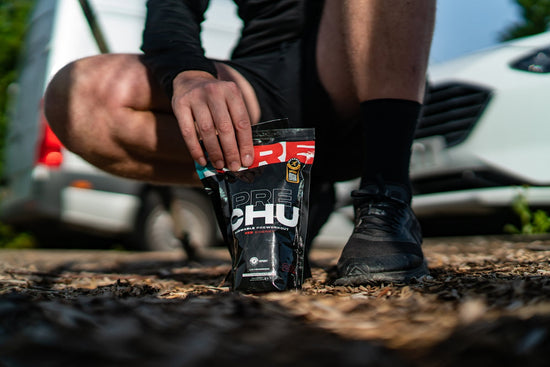 a person holding a can. BCAA post-workout powder for muscle recovery
