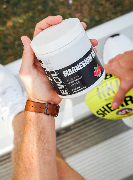 a man holding a jar of vitamin supplement. best post-workout recovery supplement