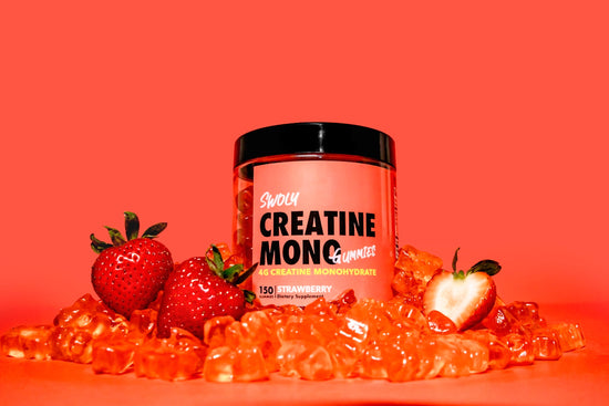 a jar of creatin monoc next to some strawberries. whey protein isolate for lean muscle