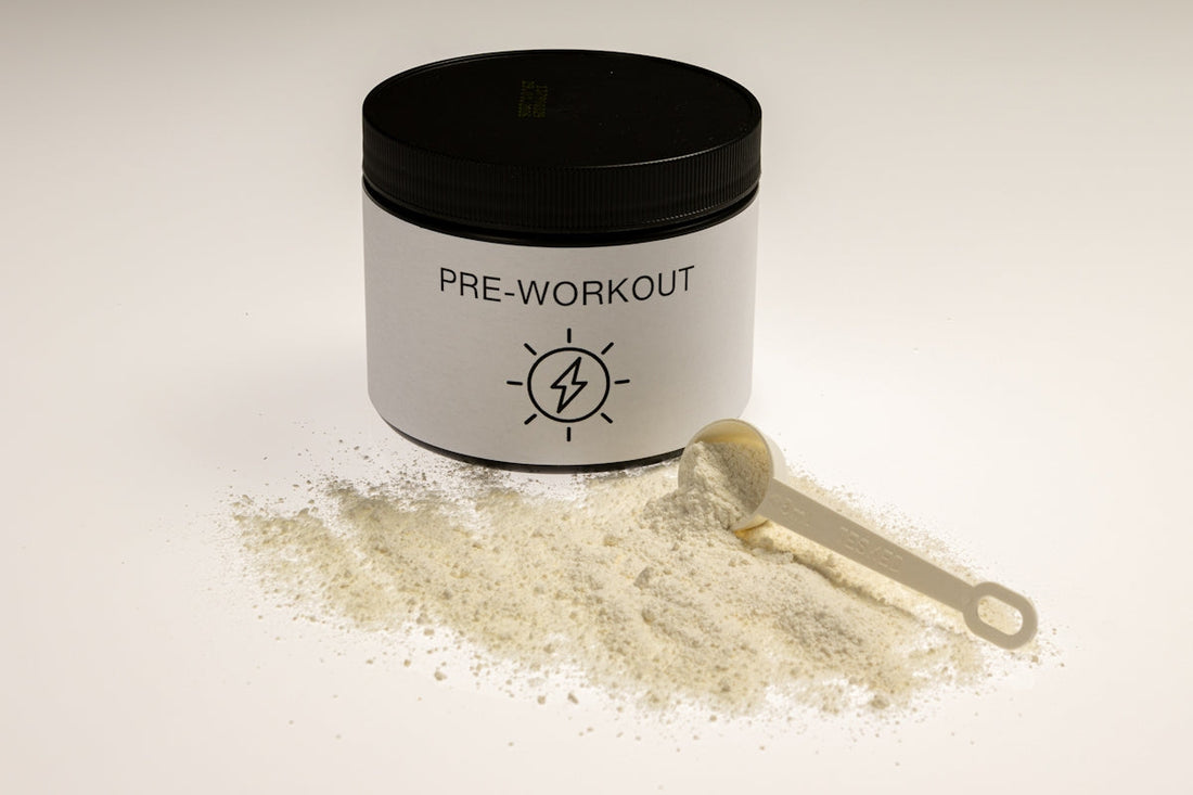 a jar of pre - workout powder next to a spoon. best workout supplements guide