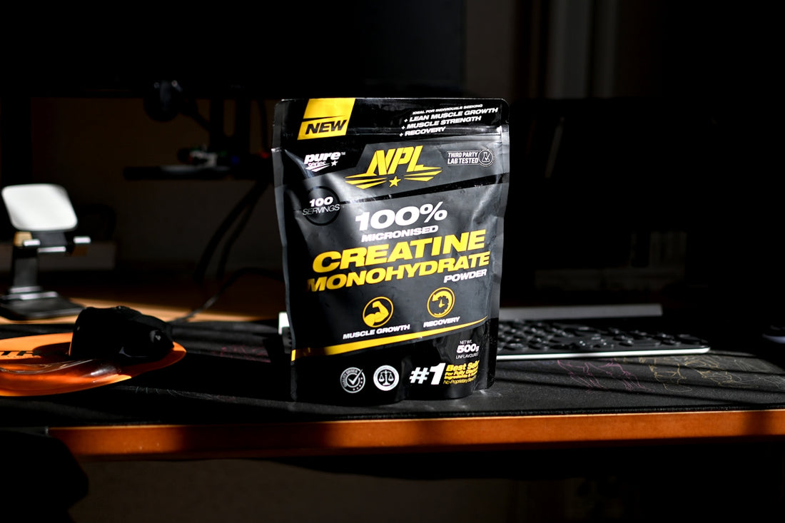 A bag of creatinne on a desk next to a keyboard
