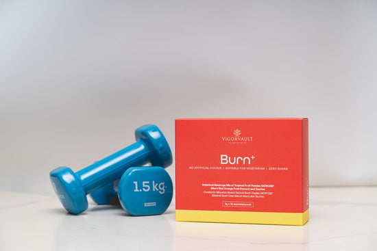 Two blue dumbbells and a box of burn supplement. best fat burner supplement for fitness goals