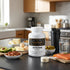 Keto BHB capsules with healthy fats, salmon, nuts, and kitchen essentials for keto diet support