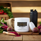 Beetroot powder supplement with fresh beets, shaker bottle, and wooden scoop on rustic table