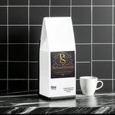BigSouthStrength Vitality Mushroom Coffee bag with white mug on marble counter, black tile background