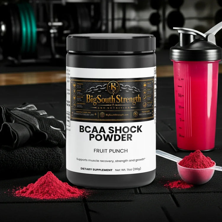 BCAA Shock Powder Fruit Punch for muscle recovery and growth, with shaker and scoop on gym mat