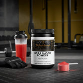BCAA Shock Powder Fruit Punch for muscle recovery and strength in gym setting