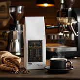 BigSouthStrength Deep Roast Coffee bag with steaming cup, coffee beans, and espresso machine