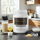 BigSouthStrength Pure3 100% Whey Protein Isolate Vanilla tub with shaker, banana, oats, and vanilla beans in kitchen