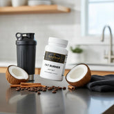 Fat burner supplement with MCT, coconut halves, coffee beans, cinnamon sticks, and shaker bottle on kitchen counter