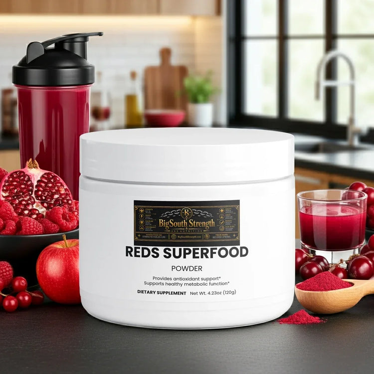 Reds Superfood Powder with antioxidant support, surrounded by fresh berries and a shaker bottle