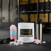 Cotton candy energy powder with shaker bottle in gym setting for workout fuel