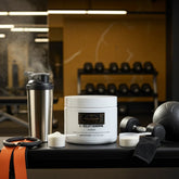 L-Glutamine powder with shaker, dumbbells, and gym gear for muscle recovery and performance